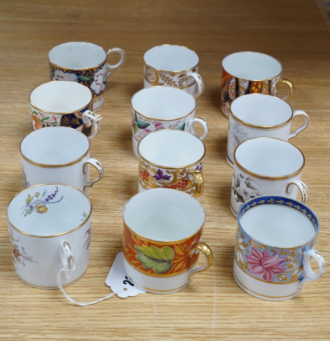 A group of twelve early 19th English porcelain coffee cans